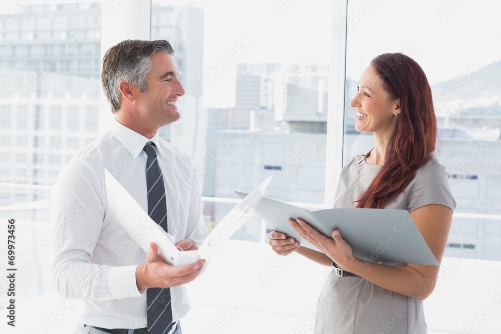 Business people smiling and talking Business people smiling and talking