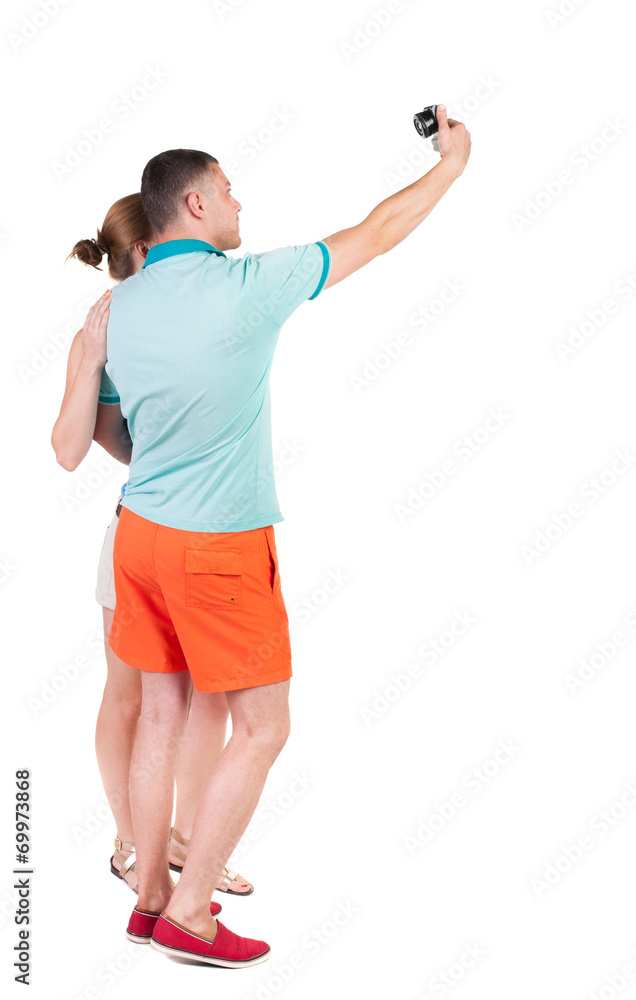 Back view of couple photographing. Back view of couple photographing.