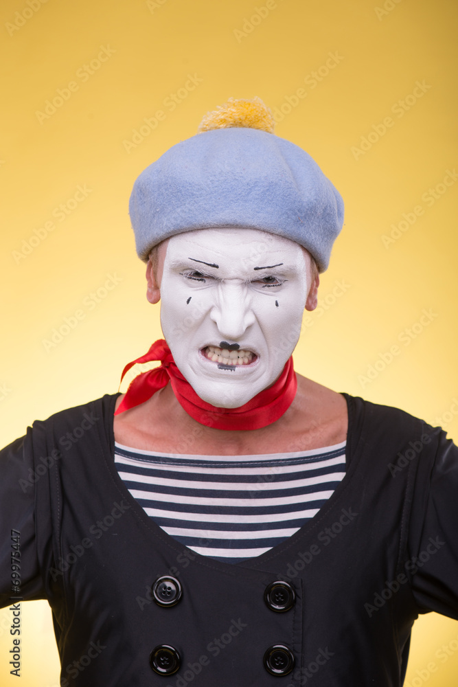 Portrait of male mime isolated on yellow background Portrait of male mime isolated on yellow background