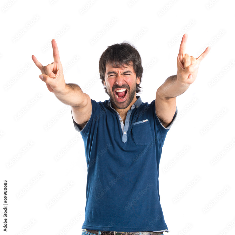 Man making horn gesture over white background Man making horn gesture over white background