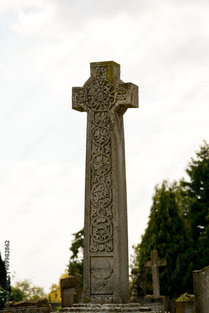 Gravestone cross with ornate pattern