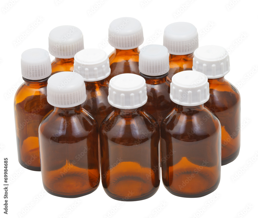 many small closed brown glass pharmacy bottles many small closed brown glass pharmacy bottles