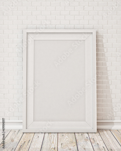 blank white picture frame on the wall and the floor