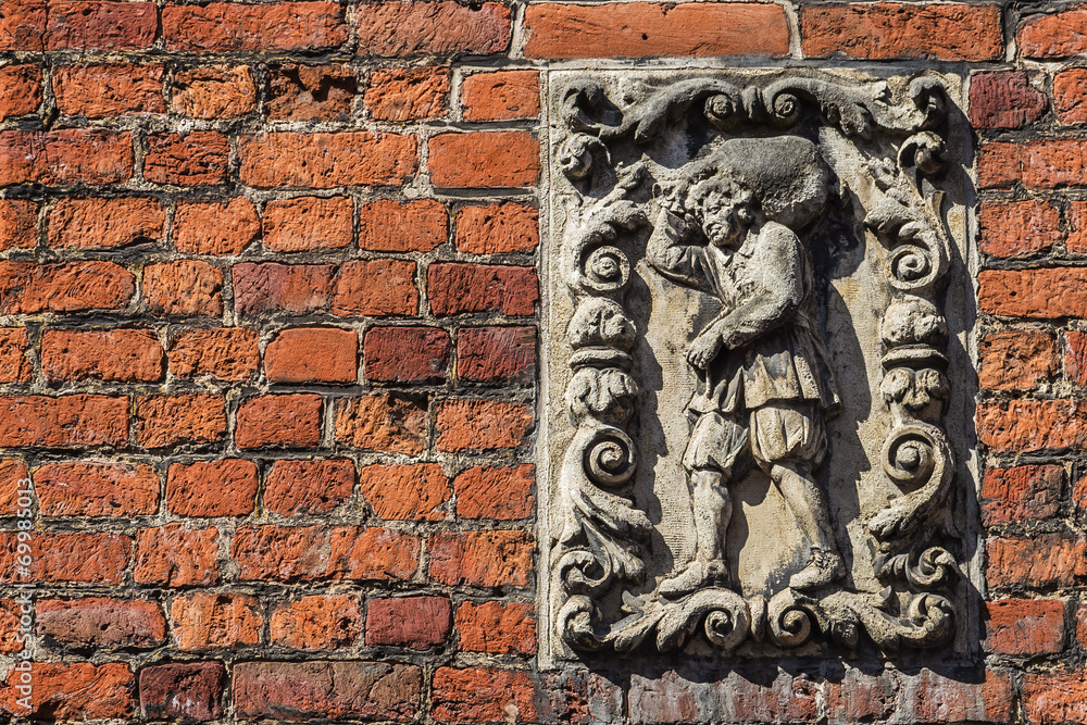 Art decor on old brickwork in Brugge, Flanders, Belgium