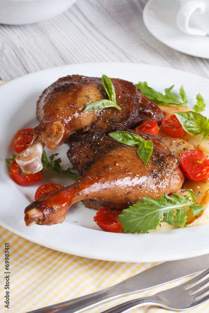 Delicious duck legs with apples closeup vertical Delicious duck legs with apples closeup vertical