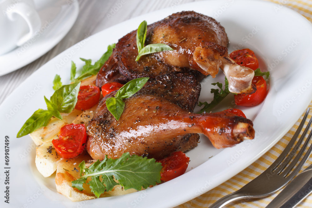 Delicious roasted duck legs with apples and arugula horizontal
