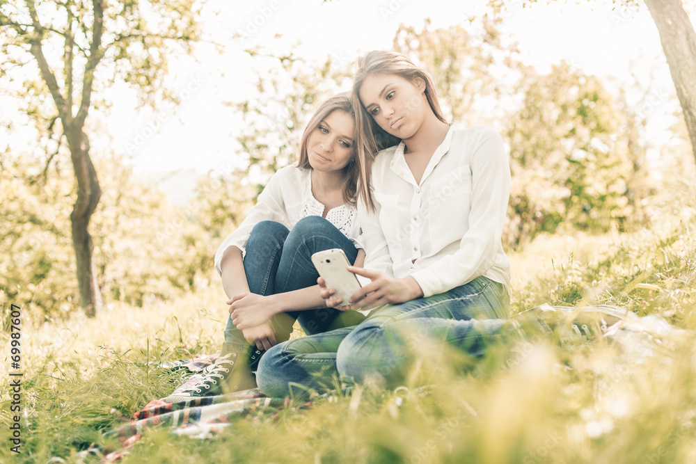 Outdoor  friends taking photos smartphone