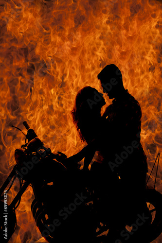 silhouette couple kiss on motorcycle fire