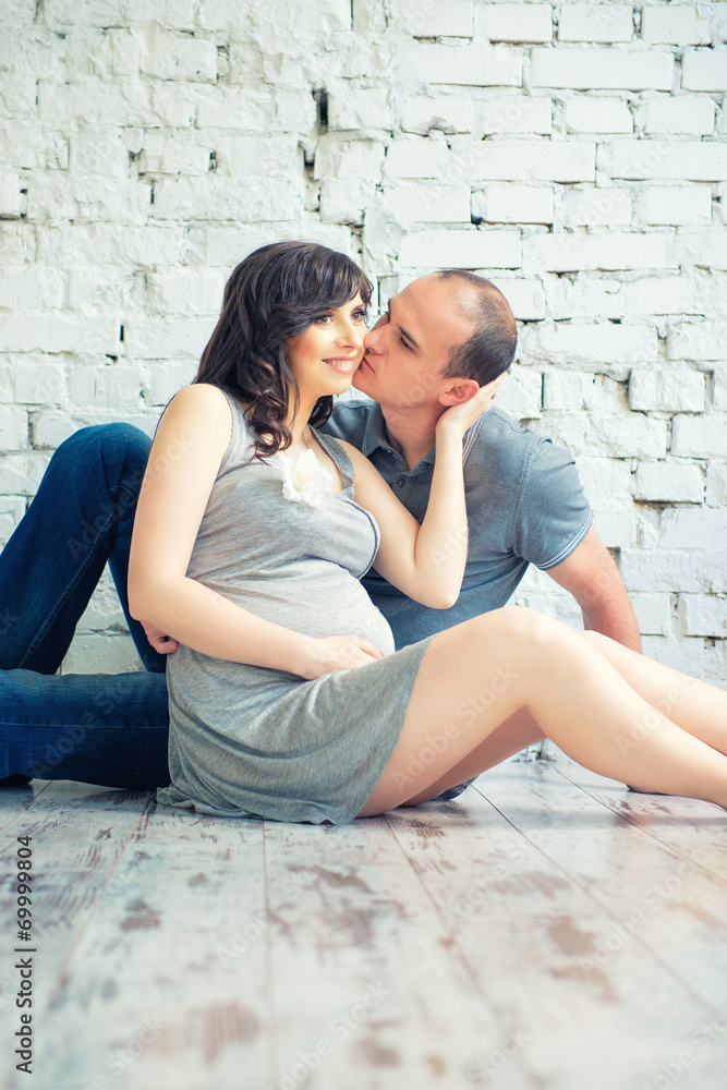 Husband kisses his pregnant wife Husband kisses his pregnant wife