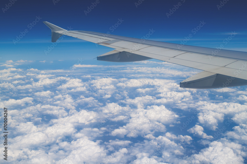 Clouds under the wing Clouds under the wing