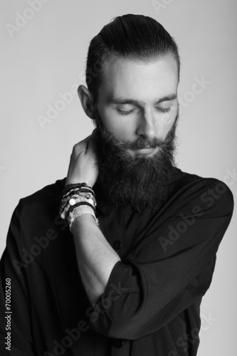 Young handsome man in black shirt on white background. Black and