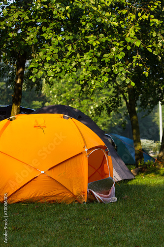 Tents and cars in an outdoor camping site 