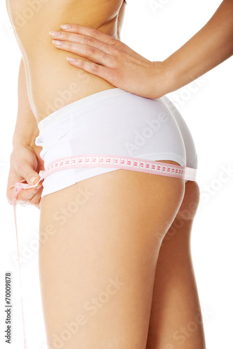 Woman measuring perfect body.