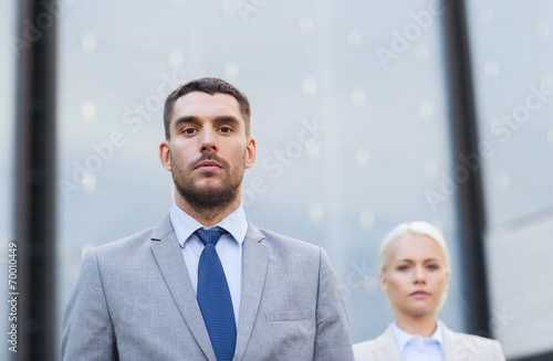 businessman and businesswoman outdoors