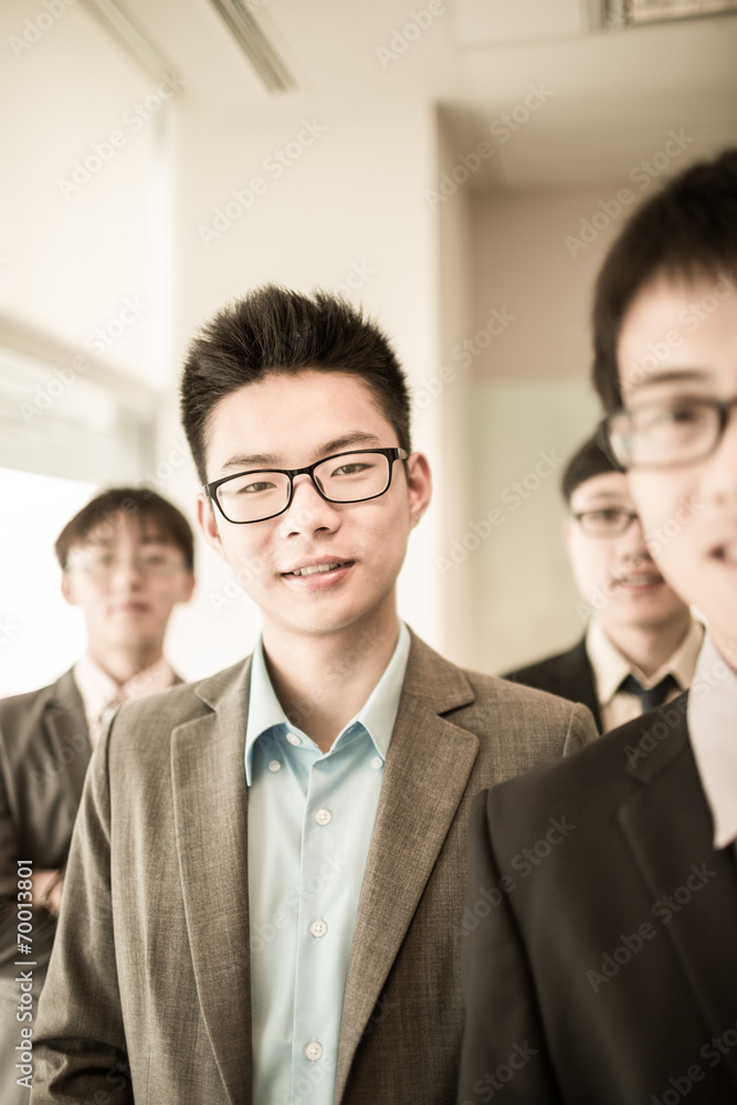 Group of business people with businessman leader on foreground Group of business people with businessman leader on foreground