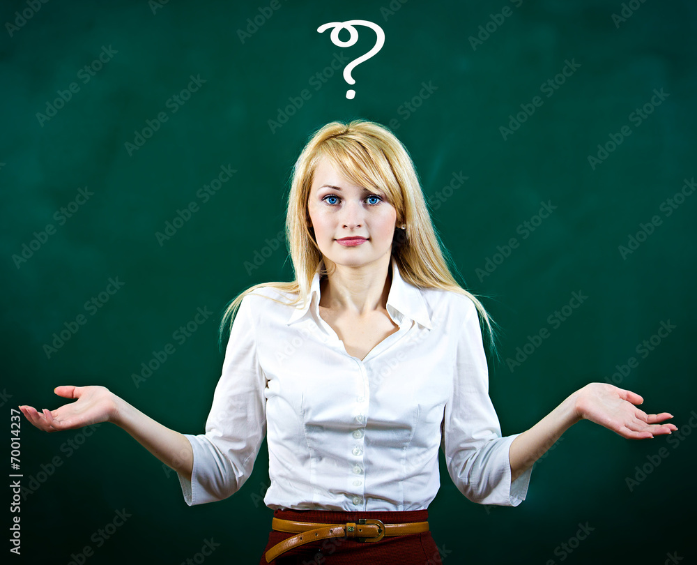 Confused, puzzled young woman shrugs shoulders has a question and no answer  