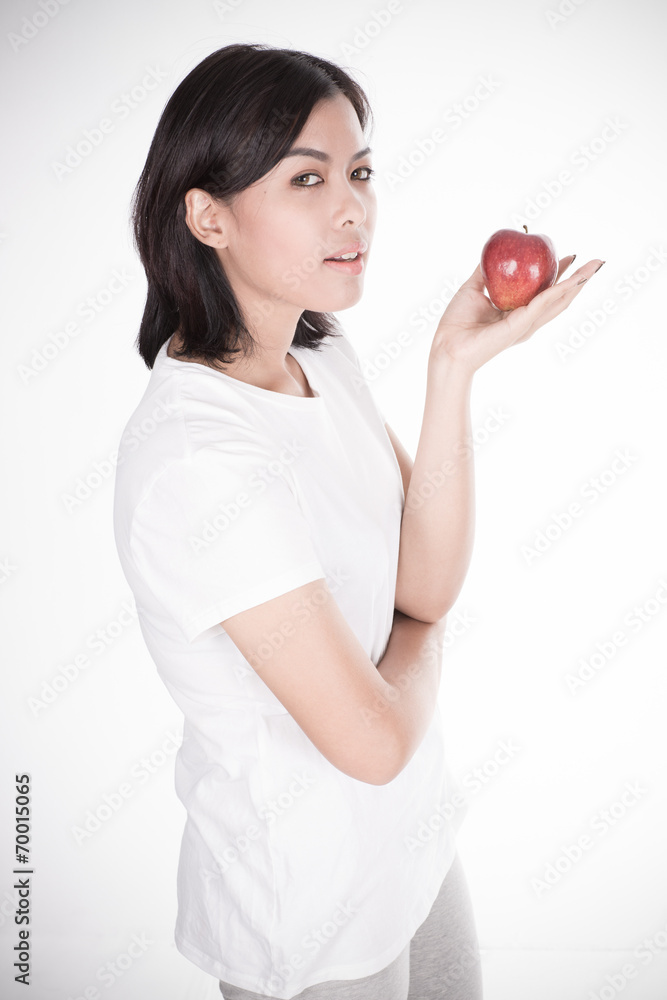 Smiling woman with apple isolated on white Smiling woman with apple isolated on white
