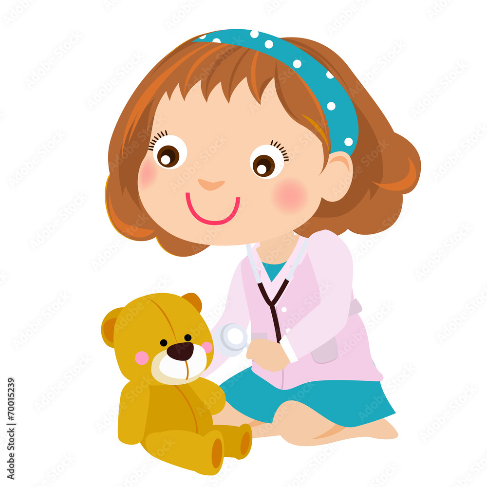 Kid girl playing doctor game with teddy bear