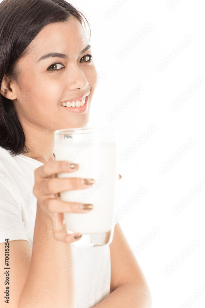 Laughing young woman with a glass of milk Laughing young woman with a glass of milk