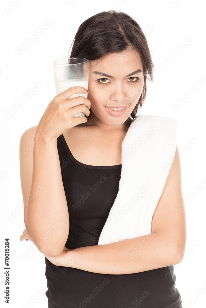 Laughing young woman with a glass of milk Laughing young woman with a glass of milk