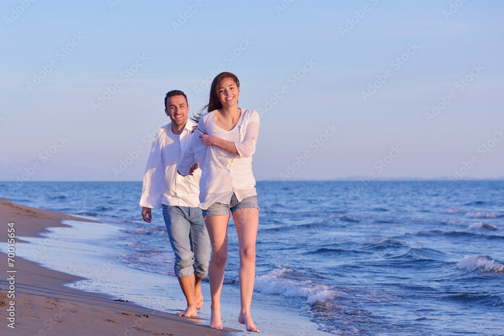 young couple  on beach have fun