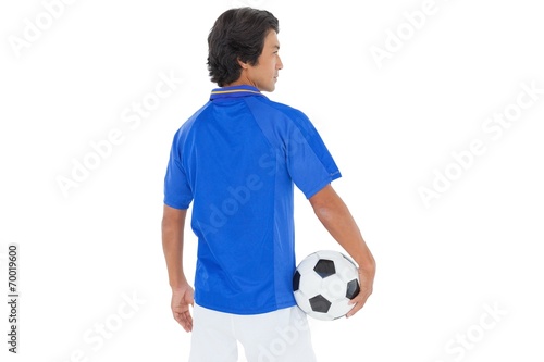 Rear view of a serious football player