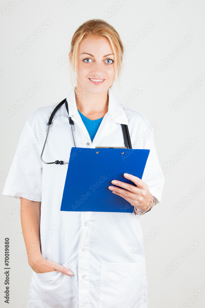 Smiling femal doctor holds medical report Smiling femal doctor holds medical report