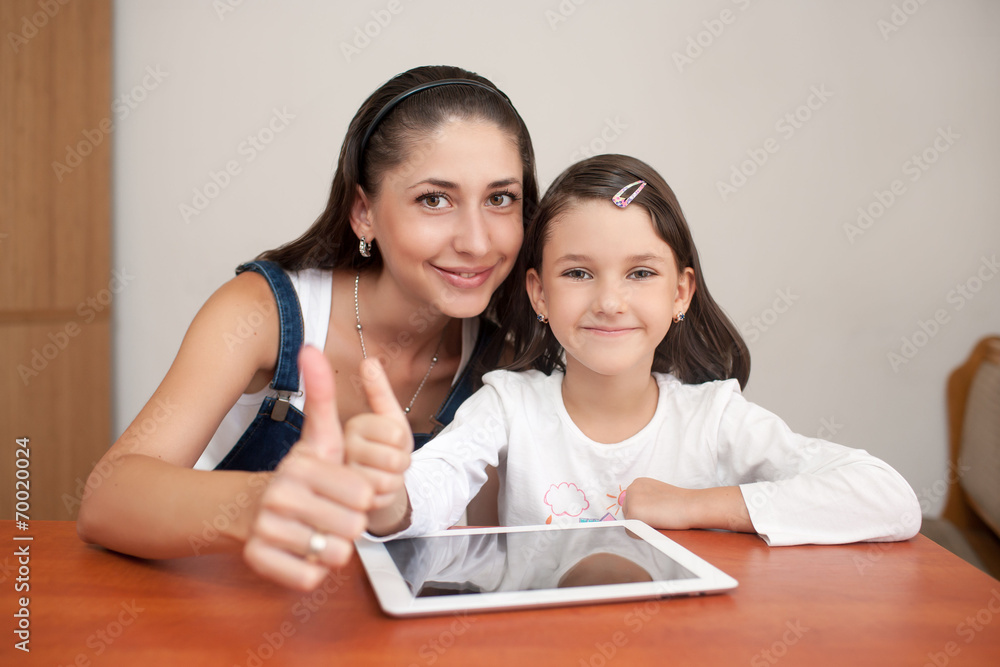 mother and daughter smiling and showing thumb mother and daughter smiling and showing thumb