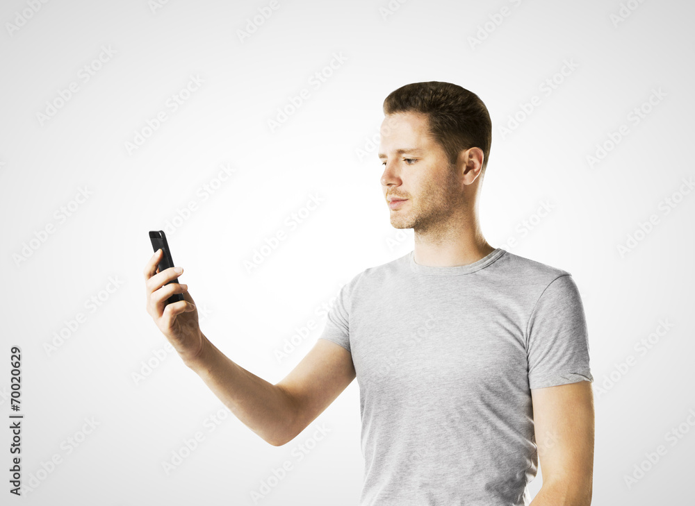 man looking at cell phone man looking at cell phone