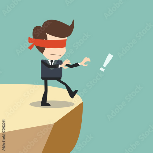 Concept of risk in business with blind businessman