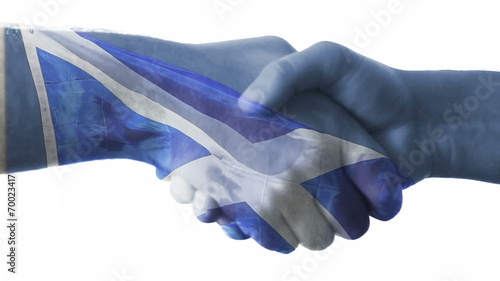 Flag of Scotland over a handshake.