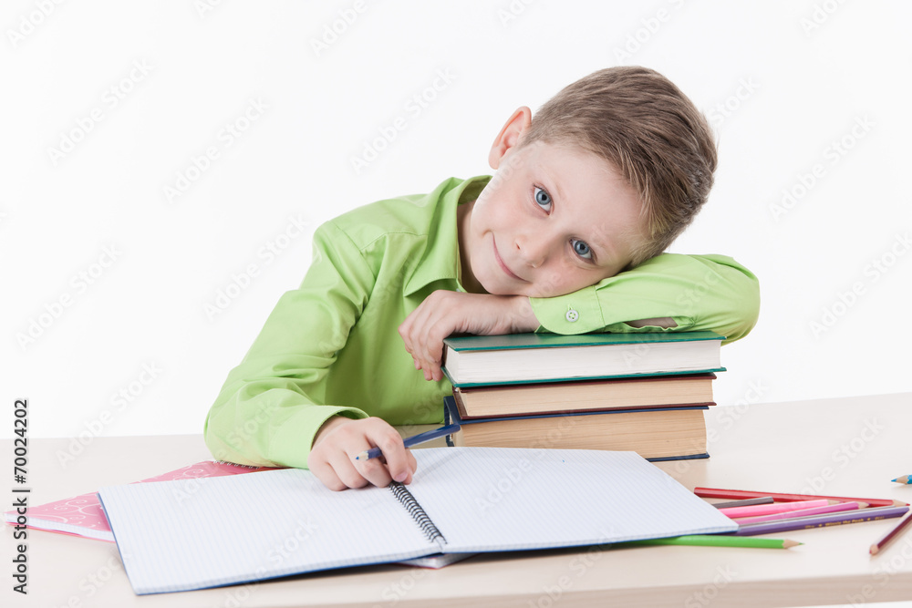 Caucasian student boy doing homework. Caucasian student boy doing homework.