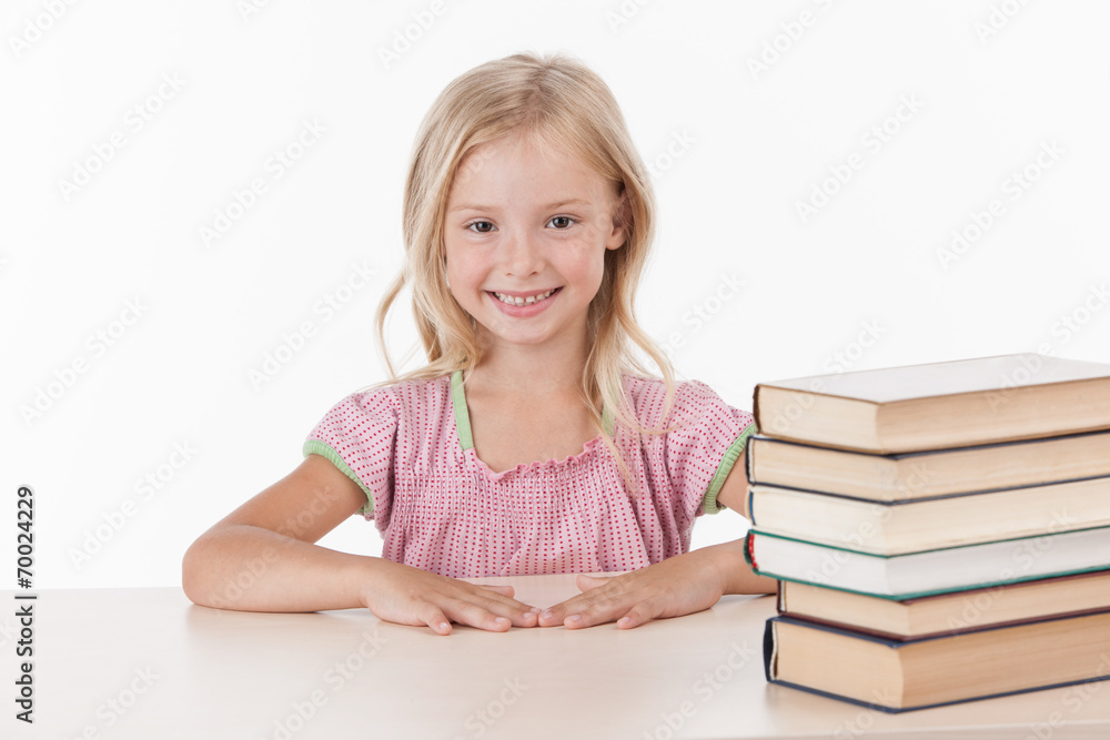 little girl studying literature and smiling. little girl studying literature and smiling.