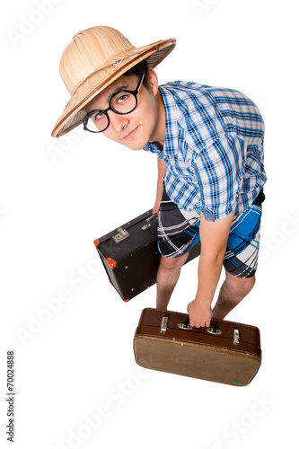 A young attractive man with glasses and two suitcases ready to t photo