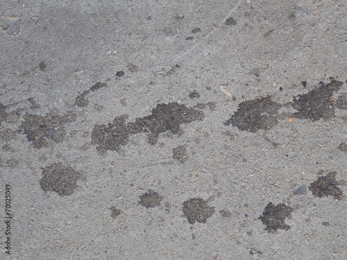 asphalt with dark spots