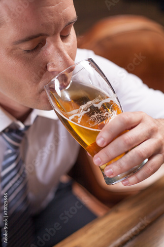 closeup portrait of man drinking beer.