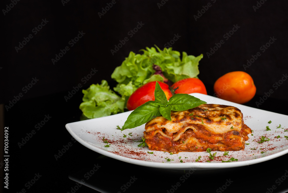 Lasagna on a square white plate Lasagna on a square white plate