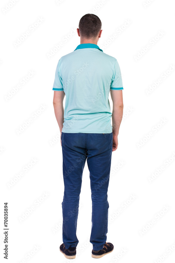 Back view of handsome man in t-shirt looking up. Back view of handsome man in t-shirt looking up.