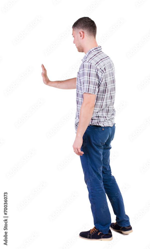Back view of handsome man in shirt. Back view of handsome man in shirt.