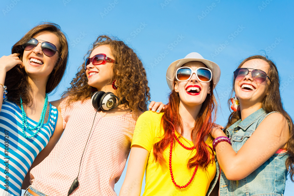 group of young people wearing sunglasses and hat group of young people wearing sunglasses and hat