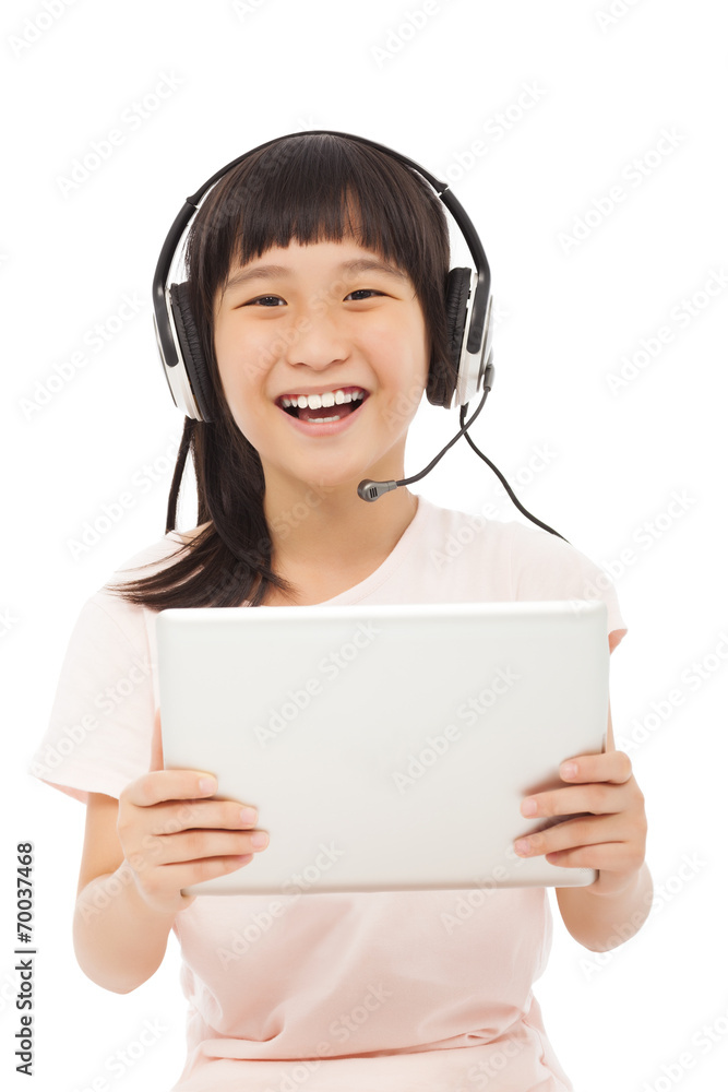 happy asian little girl holding a tablet with earphone happy asian little girl holding a tablet with earphone