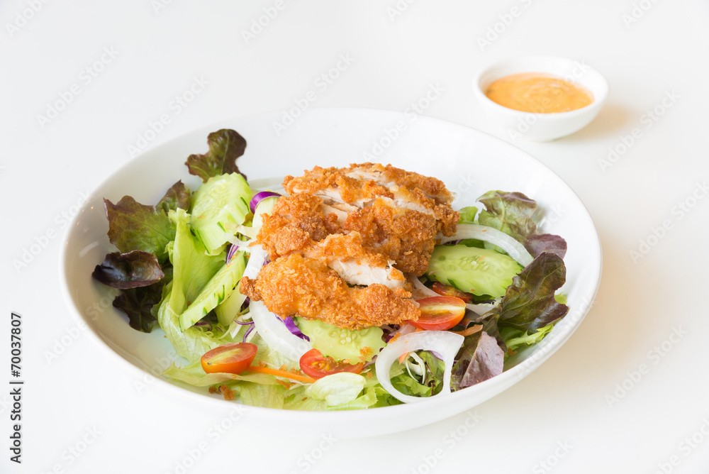Fried Chicken salad with tomatoes, Cucumber and Onion. Fried Chicken salad with tomatoes, Cucumber and Onion.