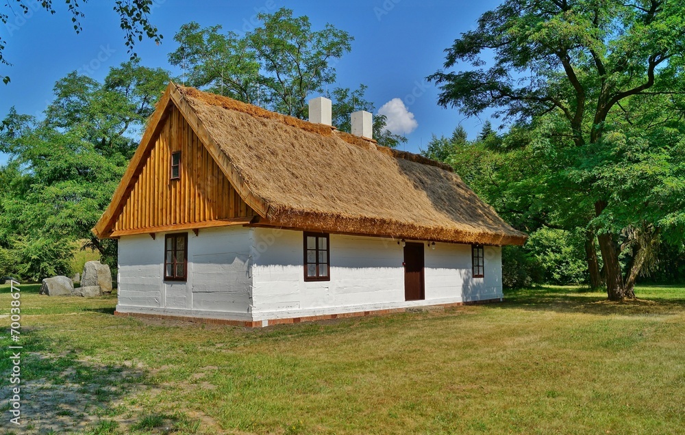 Old wooden house with straw roof Old wooden house with straw roof