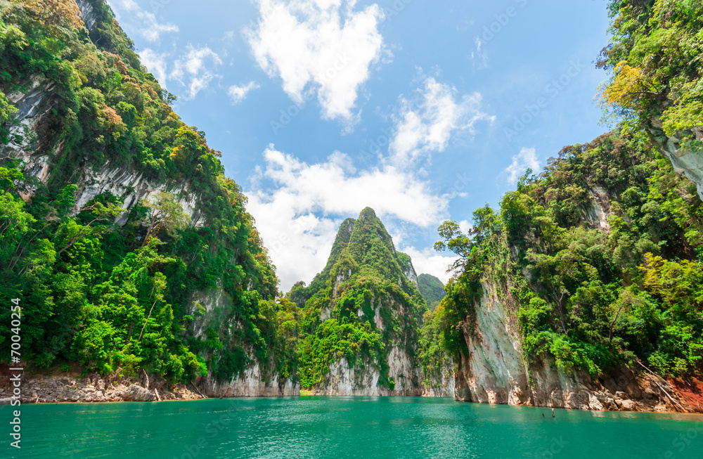 Beautiful scene of blue green clear water with rock mountain in