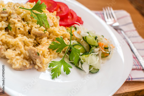 Delicious rice with pork meat and salad