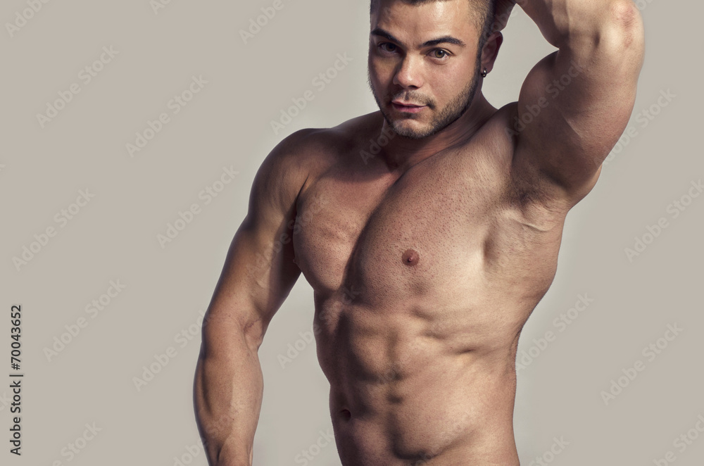 Fototapeta premium Strong bodybuilder with perfect abs, shoulders,biceps, triceps