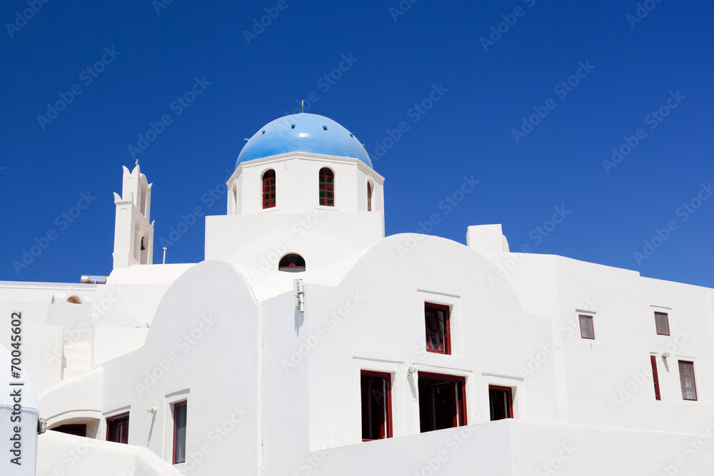 White buildings with blue domes. Oia on Santorini island, Greece