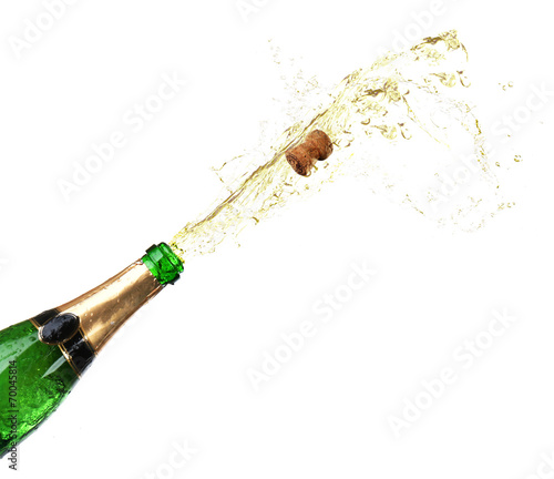 Bottle of champagne with splashes isolated on white