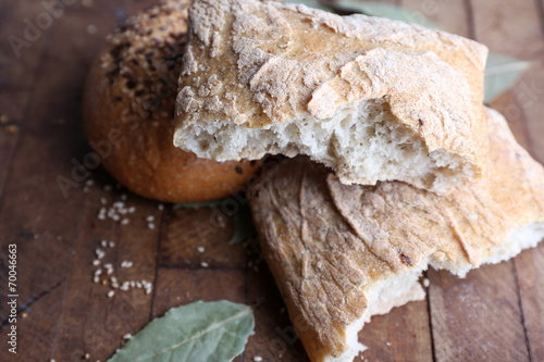 Fresh baked bread, on wooden background