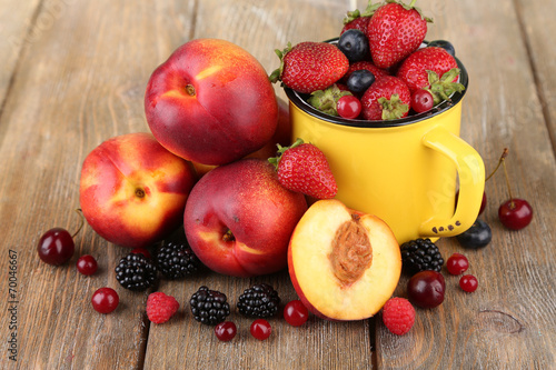 Peaches and berries on table close-up